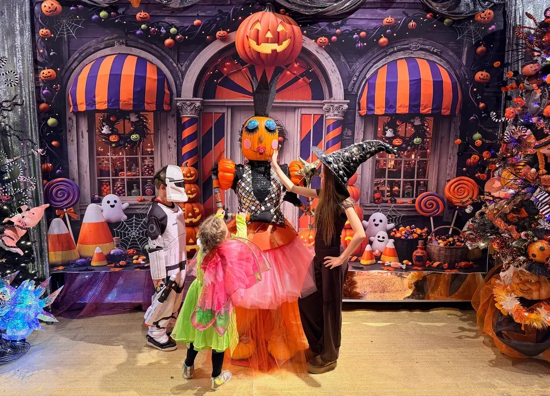 Children in costume with the giant pumpkin character