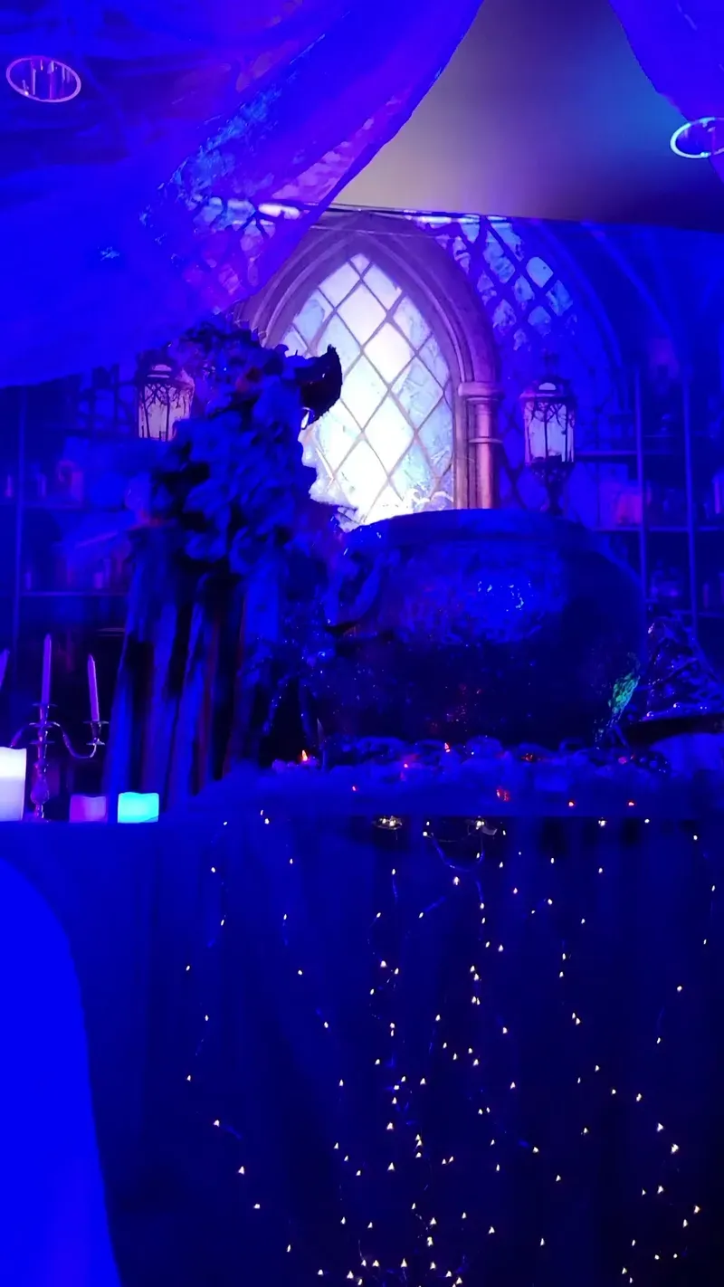The witch's cauldron glowing in blue light